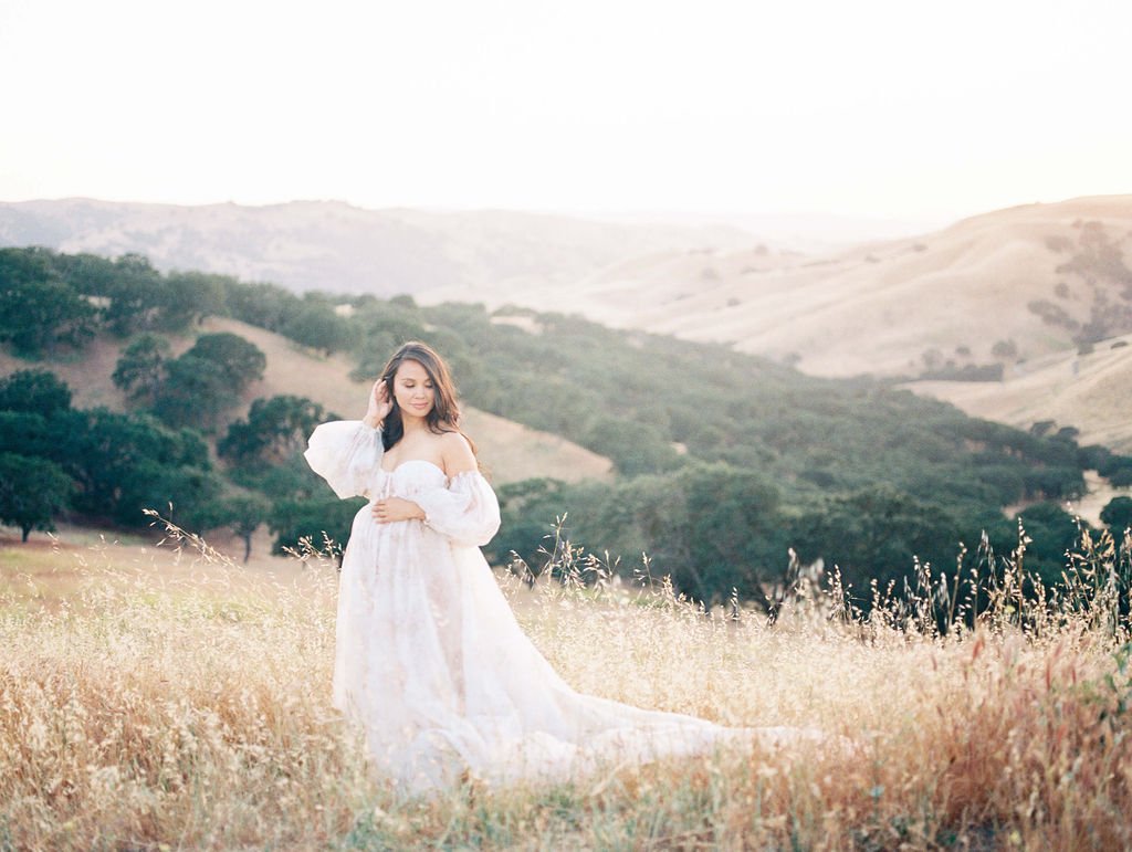 woman in white flowy dress during her maternity photos in san francisco photographed by laurel smith photography