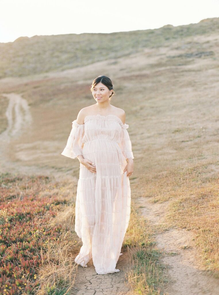 woman in flowy dress during her maternity photo shoot in san francisco