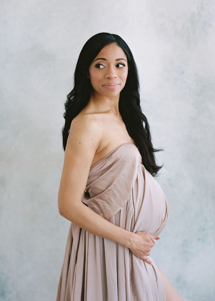woman looking sideways while smiling during laurel smith photography maternity photo shoot san francisco 