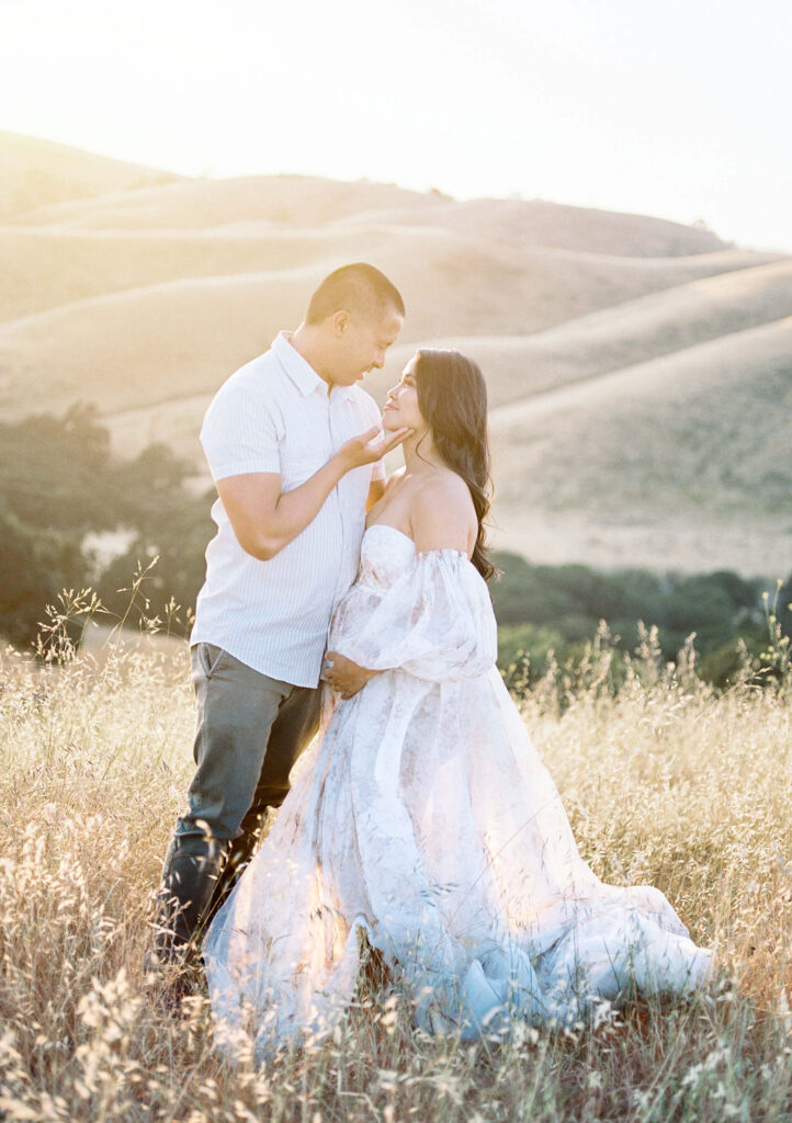 Couples maternity pictures San Francisco capturing warm, connected moments between expecting parents outdoors.