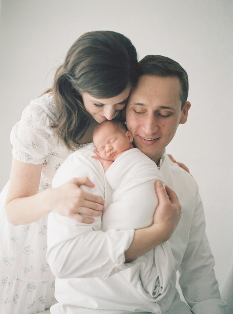 Newborn Photo Studio San Francisco | Laurel Smith Photography Newborn photo studio San Francisco with parents holding baby in soft natural light.