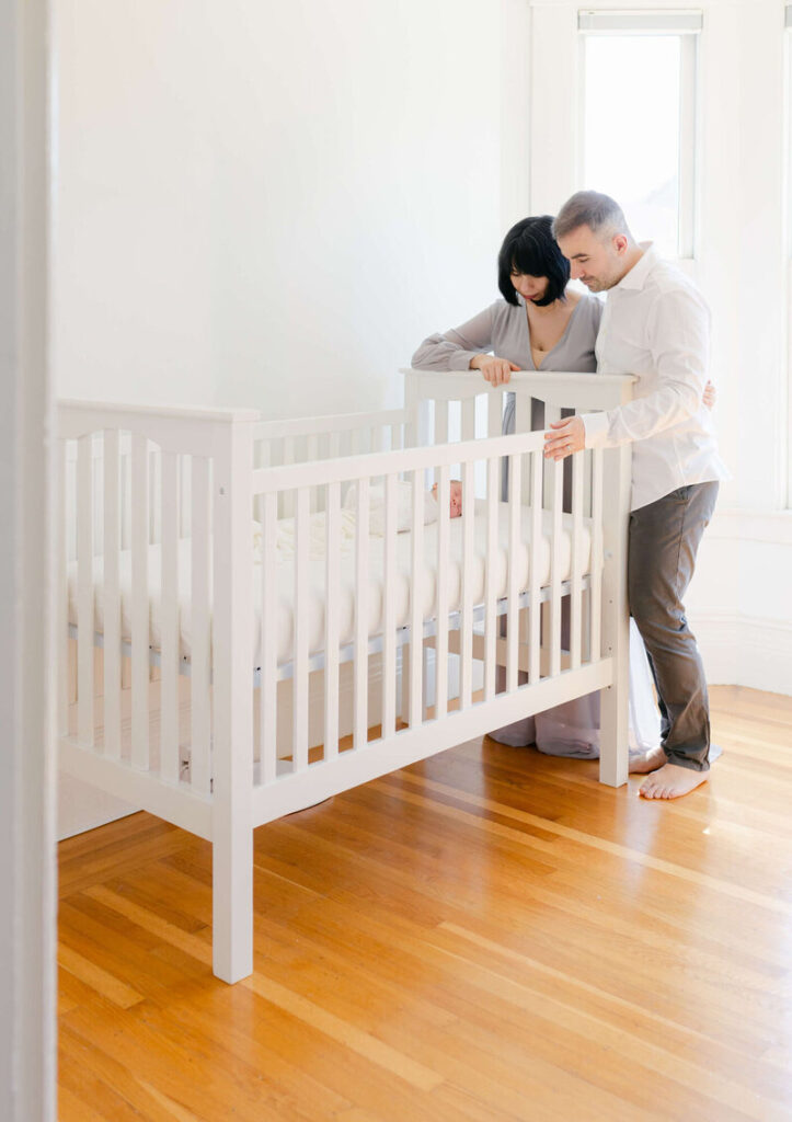 Newborn photo studio San Francisco setup with clean backdrop and window light in a private residence. 
