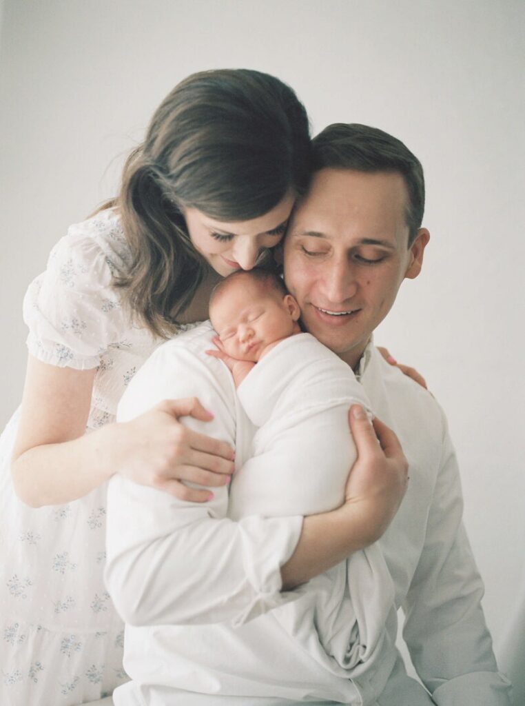 Family newborn portrait during the best time for newborn photos in studio. 