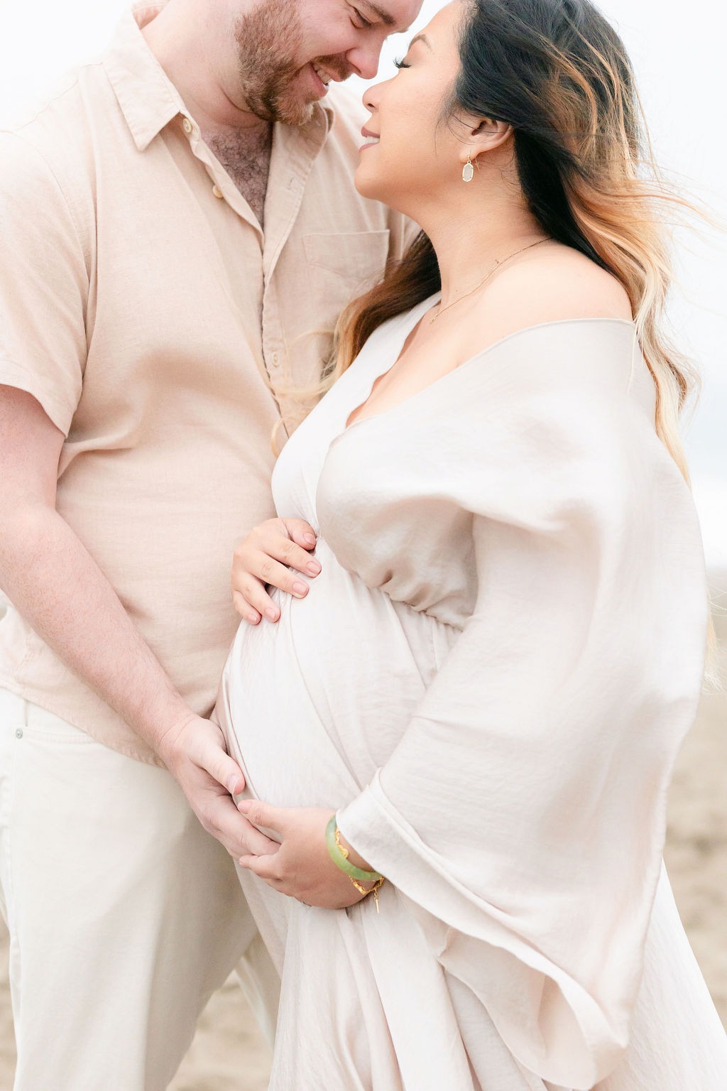 portrait of a husband and wife during their maternity shoot at one of san francisco's best photo location