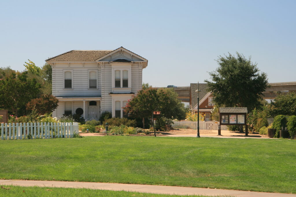 Preserved farmhouse and lawn at Emma Prusch Farm Regional Park in San Jose